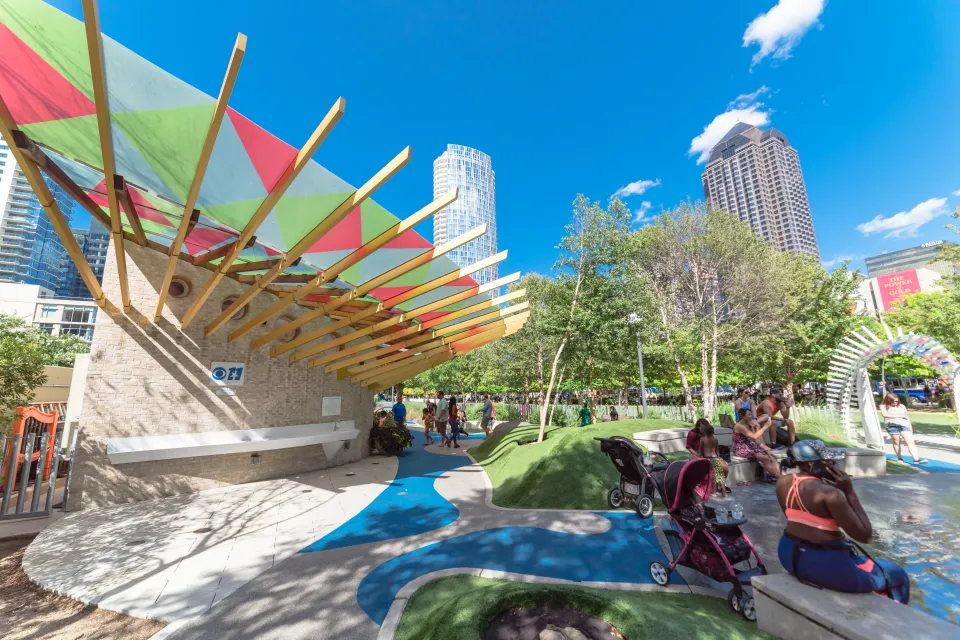 A children's play area is busy with kids and their parents in Downtown Dallas.